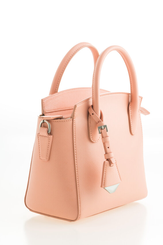 Beautiful elegance and luxury fashion leather pink women handbag isolated on white background
