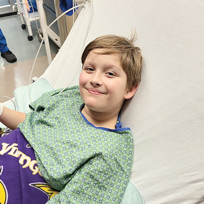 Gunnar Pitts smiles from a bed at Children’s Minnesota Hospital Dec. 9 in Minneapolis. Gunnar is a fifth-grade student at Foley Intermediate School, who has returned to school after undergoing brain surgery.