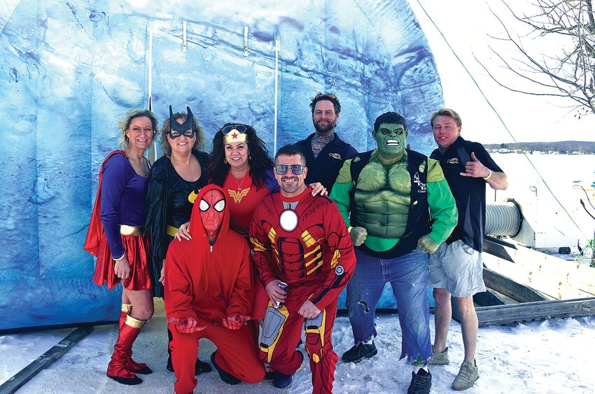 Jake Stout (front, from left) and Brad Orcutt; (middle, from left) Sandy Haffner, Shelly Weber, Angela Nies and Brian Mick; (back, from left) Charles Johnson and Jake Johnson prepare for the Stearns County Polar Plunge Feb. 17 at Middle Spunk Lake in Avon. The fundraising group, known as Team Freezin’ 4 A Reason, topped $4,000 in donations.