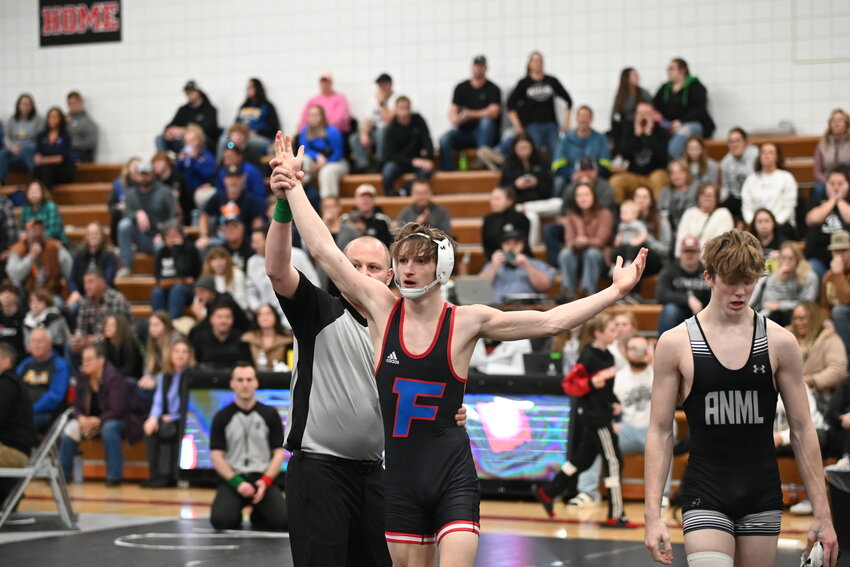 Foley’s Wyatt Wall (left) is declared the winner of the 133-pound true second match at the Section 6AA individual tournament Feb. 24 at Annandale High School in Annandale. Wall will make his first-ever appearance at the Minnesota State High School League Class AA Wrestling State Tournament March 1.