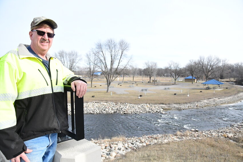 Melrose Streets and Park Supervisor Gary Middendorf overlooks the Sauk River Park Feb. 14 while standing on a newly constructed bridge in Melrose. During his 41 years working for the city, he has been involved in many projects, including this park and the bridge project.