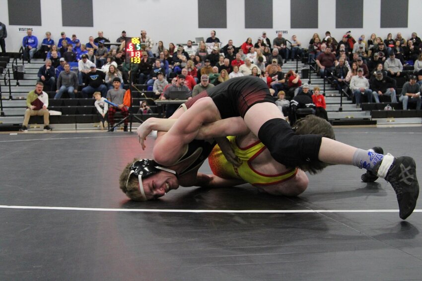 Rylan Pallow looks for an opening Feb. 23 in the Section 8AA 145 division at Dilworth. Pallow scored a first round pin in the tournament.