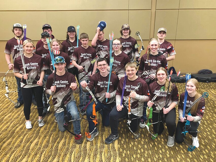Many members of the Sauk Centre archery high school team – Eli Borgerding (front, from left), Zach Klimek, Bryce Parish, Maddy Schuster and Mylee Middendorf; (middle row, from left) Aubree Randall, Alexis Engle, Cody Soenneker, Alexandra Goerdt and Kyra Dickmann; (back, from left) Ben Eekhoff, Parker Sorenson, Drake Bass, Jayden Randall, Elijah Duchene, Keegan Middendorf and Rylan Pallow – celebrate a successful Minnesota NASP Bullseye State Tournament March 23 at Mayo Civic Center in Rochester. The Streeters high school team achieved a new program-best team score of 3,358. Not pictured: Carmen Loxtercamp, Carly Gruenes, Dylan Gruenes and Alexis Groetsch.