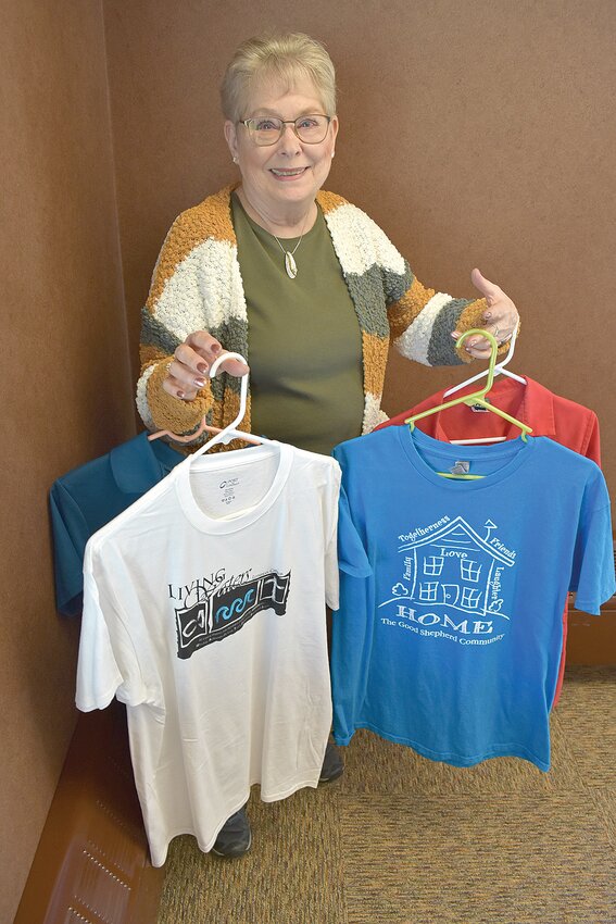 Sauk Rapids resident Terry Sylvester displays colored shirts she wears as a volunteer with four organizations while inside of The Good Shepherd Community April 5 in Sauk Rapids. Sylvester has been a volunteer for 25 years; April is National Volunteer Month.