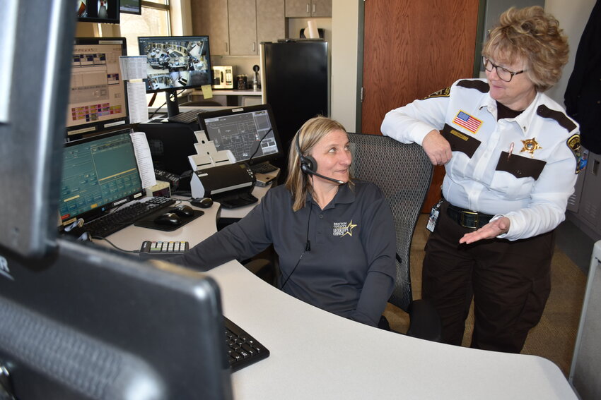 Benton County public safety dispatcher Joyce Zika (from left) reacts to a comment from Lt. Julia Fraley, emergency communication center manager, during the April 4 day shift in the county’s first-floor dispatch center at 581 Highway 23 in Foley. Dispatchers will be recognized at all government levels for their commitment and service during National Public Safety Telecommunicators Week April 14-20.