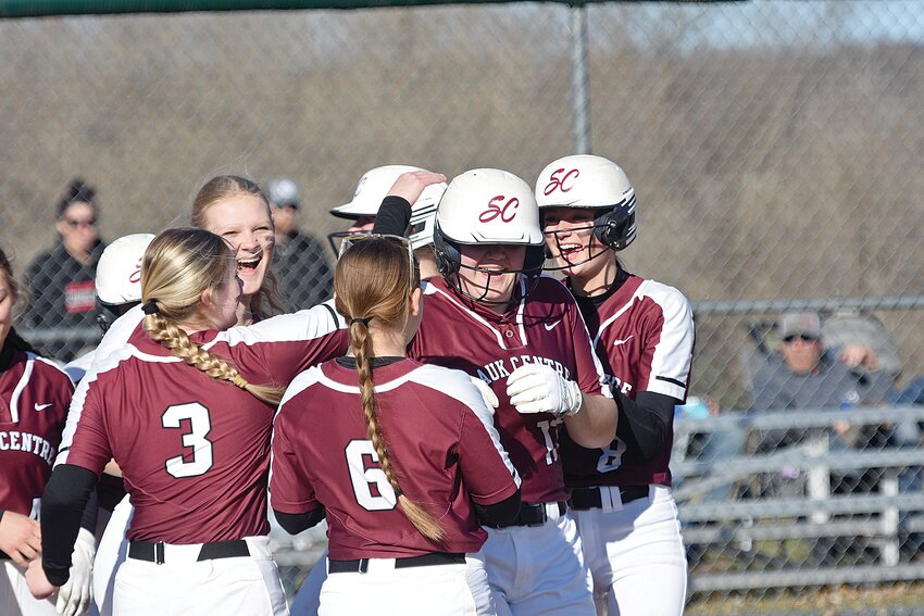 The Streeter players celebrate with freshman Jenna Riley (second from right) after she hit a three-run home run during their home game April 12 against Osakis. It was the Riley’s first career homer, and it sparked the Streeters to a 13-9 victory.