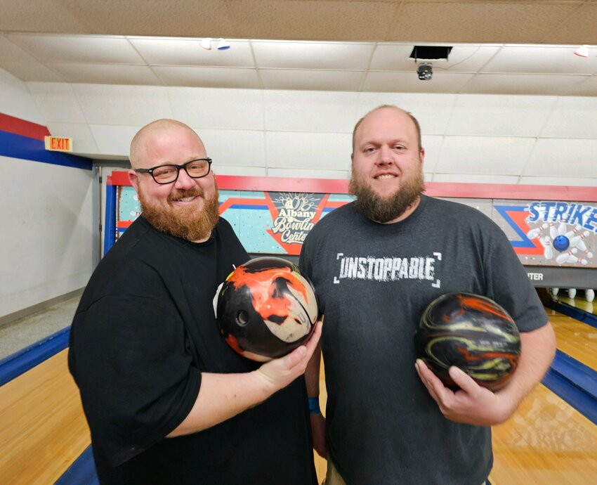 Gordy Dirkes (left) and Matt Sauer are the winners of the 31st Men’s Doubles Tournament March 9 at Albany Bowling Center in Albany. They also rolled the high combined game.