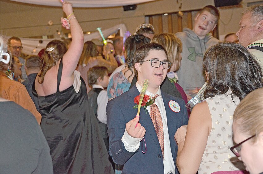 Vaughn Roodell, of Ogilvie, dances with a family member April 19 on the floor at Mr. Jim’s in Foley. Event organizers reported more than 150 individuals with disabilities celebrated the third annual Special Needs Prom in Foley.