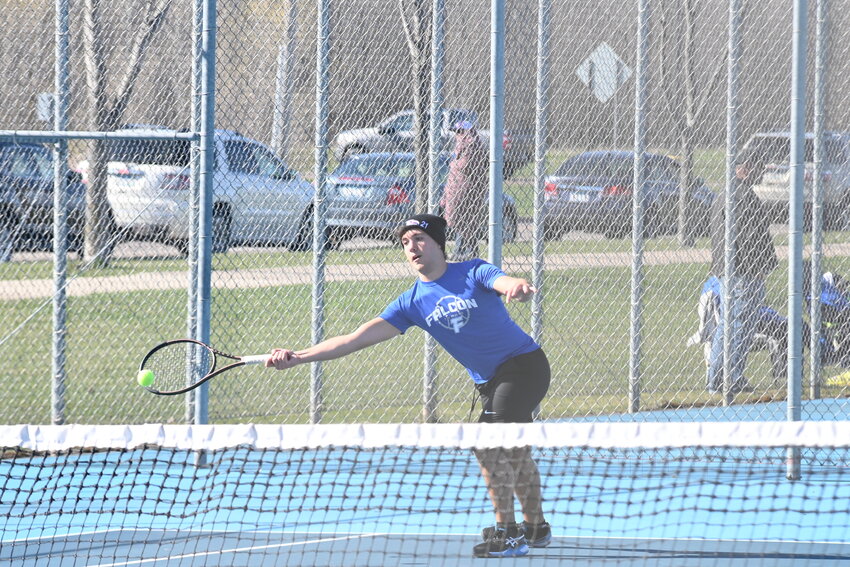 Landon Harris fully extends to keep his racket on a ball against Aitkin April 22 at Foley High School in Foley. Harris and No. 1 doubles partner Jack Erkens dominated in their matchup, winning 6-1, 6-1.