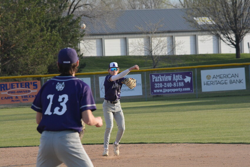 Albany second baseman Bennett Hylla (right) throws to first baseman Elliott Burnett for an out in the second game of a doubleheader against Pequot Lakes April 25 at Blattner Field in Avon. The Huskies swept their conference rivals, winning game one 16-2 and game two 4-0.