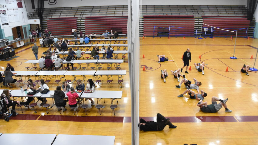 Lunch and physical education are held side-by-side in the Sauk Centre High School gym April 26 in Sauk Centre. Lunch has been in the gym since work began on expanding and renovating the high school cafeteria.