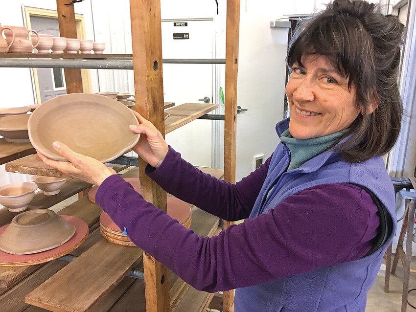 Renee Zeleny displays an unfired pottery bowl with a fluted rim during an April 24 tour of her rural Sauk Rapids studio and business, Blue Note Pottery. Zeleny has been making pottery for over 30 years and recently received recognition and an award as 2024 Central Minnesota Arts Board individual artist.