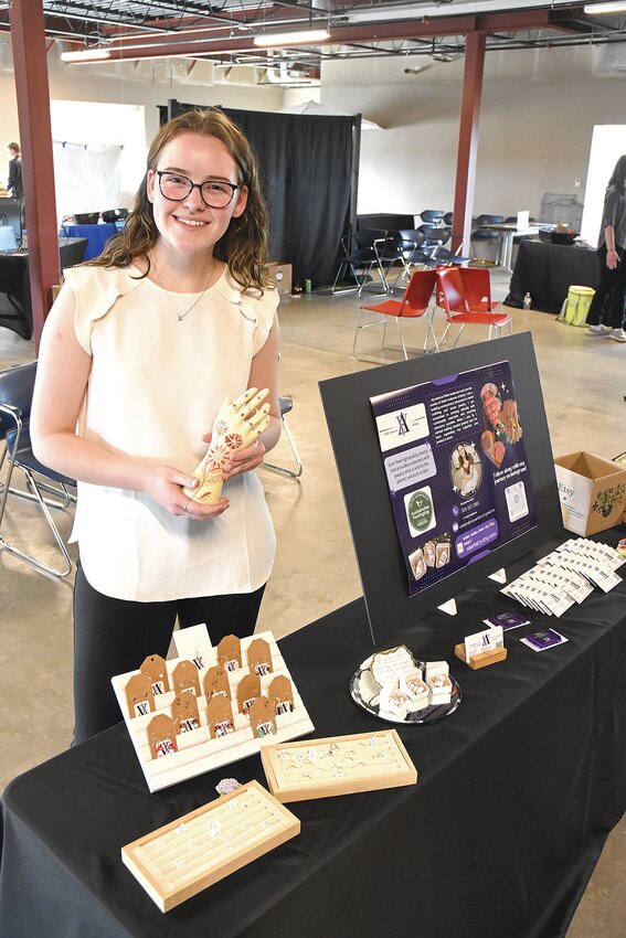 Sauk Centre High School senior Violet Anderson displays her handmade silver jewelry offered through her business, Violet Anderson Artistry, during the West Stearns Creating Entrepreneurial Opportunities Trade Show May 1 at Minnesota National Bank in Sauk Centre. Anderson started by making wire wrap jewelry.