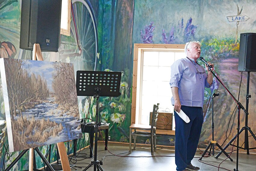 Greg Konsor describes this “Two Rivers Spring Thaw” painting by  Dan Mondloch, unveiled during the April 25 opening of the We Are Water MN exhibit at Art in Motion north of Holdingford. Konsor, owner of Art in Motion, explained the connections water and art have.
