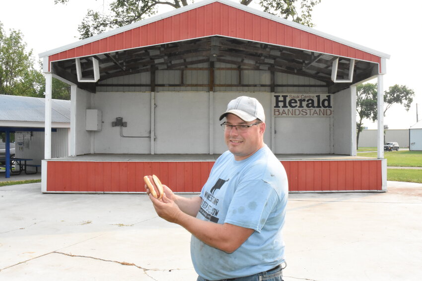 Steve Frericks brings a hot dog to the Herald Stage July 22 at the Stearns County Fairgrounds in Sauk Centre. The Stearns County Fair Board is introducing hot dog and hot wing eating contests to this year’s Stearns County Fair.