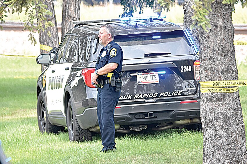 Minnesota Bureau of Criminal Apprehension crime scene technicians check a measurement during a July 21 death investigation in Sauk Rapids Lions Sunset Park in Sauk Rapids. The Sauk Rapids Police Department requested the assistance of the Minnesota Bureau of Criminal Apprehension with the death investigation Sunday.