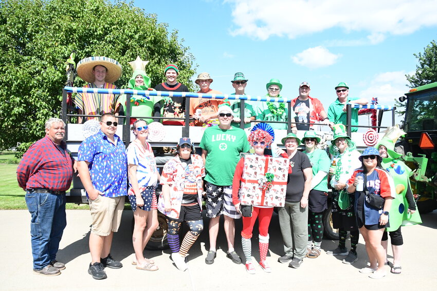 Rueben Schwieters (front from left), Chris Frieler, Brittany Frieler, Amber Van Drehle, Tim Thielen, Kelly Thielen, Paula Schwieters, Peg Thelen, Kurt Thelen, Lesley Burandt and June Schwieters; (back, from left) Brady Van Drehle, Lynn Van Drehle, Travis Thelen, Norm Schwieters, Joe Schwieters, Sharon Schwieters, Nathan Schwieters and Scott Thelen gather in front of and on a hayrack Sept. 1 in New Munich, where they took off on their Labor Day Sunday hayride. This family tradition started in 2002 and often included their parents, Otto and Fran Thelen.