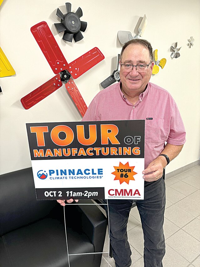 Russell Scheller, Pinnacle Climate Technologies’ vice president of operations, displays a Central Minnesota Manufacturing Association tour sign Sept. 25 inside the company’s Sauk Rapids facility. Pinnacle Climate Technologies invents, develops and manufactures heating and ventilation systems serving commercial, industrial, agricultural, do-it-yourself and other retail channels worldwide.