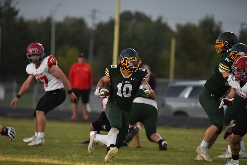 Storm running back Deagan Gondeck runs for a 44-yard touchdown in the first quarter Friday night against Elk River at Sauk Rapids-Rice Middle School Stadium in Sauk Rapids. The Storm fell 58-19 to the Elks.