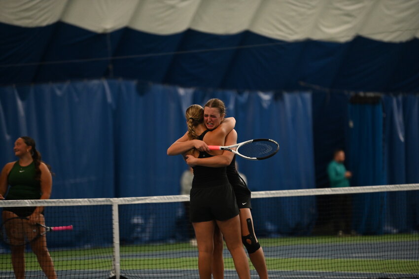 Sage Greenwaldt tearfully embraces third doubles teammate Megan Cielinski after their Section 7A championship match Oct. 10 at Sta-Fit in Sartell. Greenwaldt and Cielinski lost in a thrilling three-set thriller that included a tiebreaker.