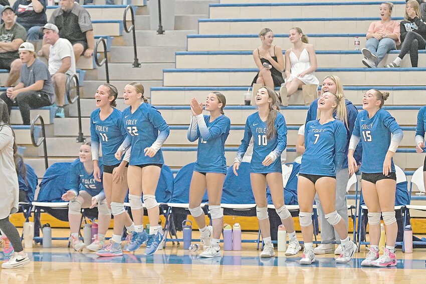 McKenna Rajkowski (front, from left), Carly Hackett, Kylie Storkamp, Addie Beier, Atley Gruba and Lily Rygh get energized on the bench while watching their teammates perform against Pequot Lakes Oct. 10 at Foley High School in Foley. The Falcons earned a 3-0 upset win over reigning Class AA state champion Pequot Lakes.