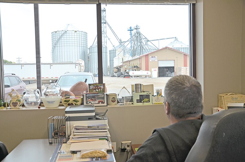 Adam Bonovsky, chief operating officer and general manager at Gilman Co-op Creamery, looks out his office window at the recently constructed 107-foot-tall grain bin Oct. 3 in Gilman. Boasting roughly 247,000 bushels of storage space, the new unit increases Gilman Co-op Creamery’s total on-site grain storage room by about 60%.