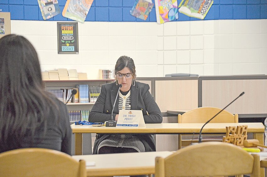 Foley Public Schools Superintendent Trish Perry addresses school board members during a nearly nine-minute speech explaining her reasons for leaving the district Oct. 8 inside a special meeting at Foley Intermediate School in Foley. Perry said she would submit her formal resignation before the Oct. 14 school board meeting, effective June 30, 2025