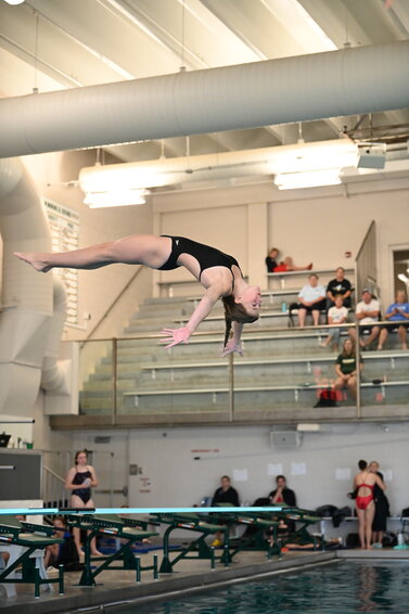 Storm diver Esme Grabinski prepares to enter the water on a back dive during the Sauk Rapids-Rice Diving Invitational Oct. 5 at the Sauk Rapids-Rice High School pool in Sauk Rapids. Grabinski placed first in the competition of 16 divers.