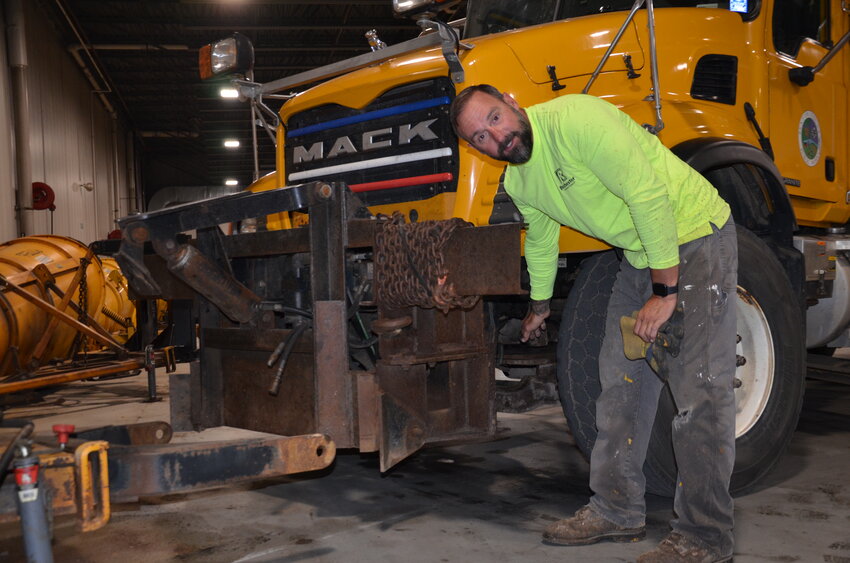 Geoff Gazett inspects the tires of a 2006 Mack dump truck used as a snowplow for the Benton County Highway Department Oct. 16 at the Benton County Public Works facility along Highway 25 in Foley. This winter will mark Gazett’s first season blowing snow with the Benton County Highway Department.