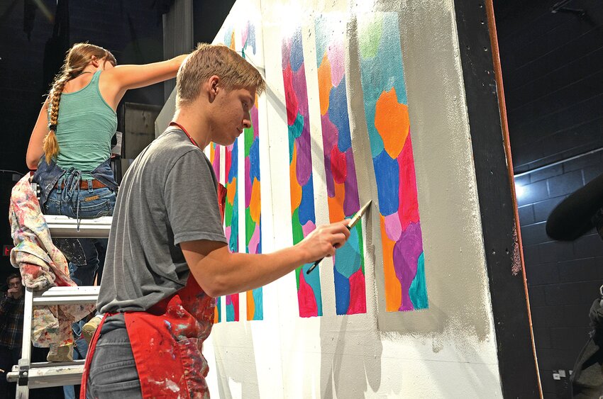 Junah Rudolph applies paint to a set piece that serves as the backdrop for Foley High School’s production of “The Best Christmas Pageant Ever: The Musical” during an Oct. 11 practice in the FHS auditorium in Foley. The performances are scheduled at 7 p.m. Oct. 25 and Oct. 26 and a matinee show at 2 p.m. Oct. 27.