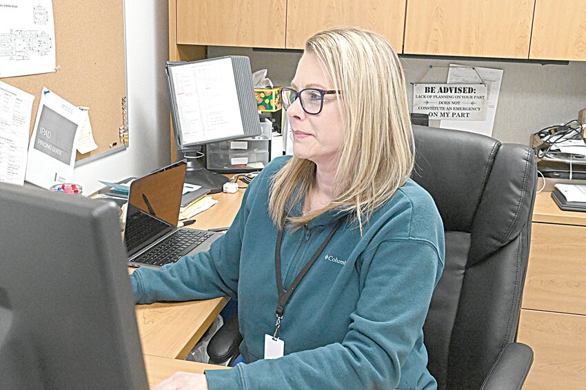 Sauk Centre Public Schools technology director, Becki Marthaler, works at her desk March 5 as she manages the district’s information technology platforms in Sauk Centre. Marthaler and district officials were notified of a data breach Jan. 7 of student and employee information going back to the graduating class of 2006.