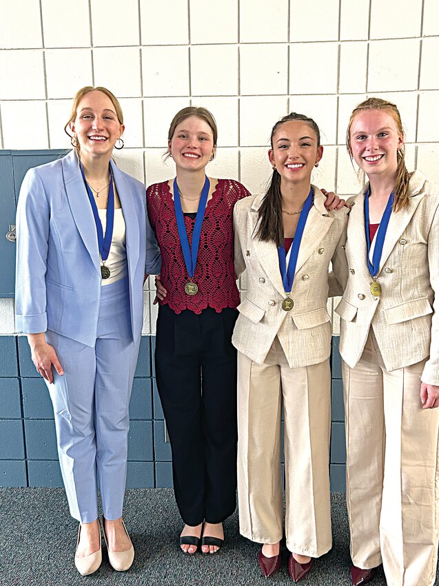 Sauk Centre speech team members Liz Eiden (from left), Anastasia Polipnick, Julia Wehrman and Olivia Marsh display their medals after placing first in their respective categories at the Section 5A competition April 12 at Annandale High School in Annandale. The top three competitors in each category advance to state competition April 25 in Shakopee.