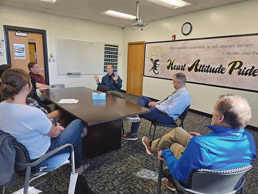 Iowa District 5 Representative Zach Dieken (center) speaks with Cherokee school staff, administration and board members on Sept. 30 after touring facilities.