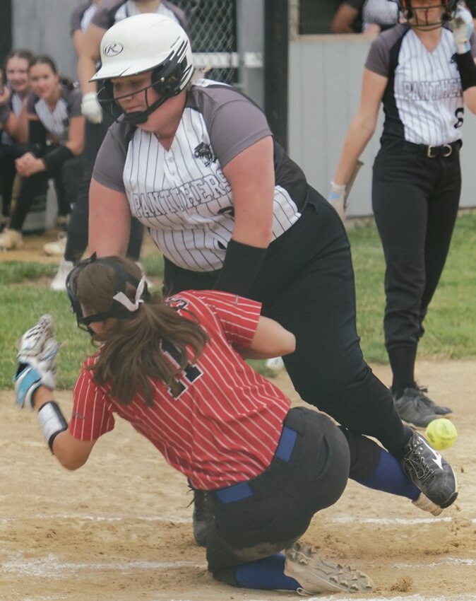 St. Mary’s Jenna Merten collides with Siouxland Christian/Whiting pitcher Cassidy Loonsfoot at home plate during Monday’s game. TIMES PILOT photo by JAMIE KNAPP