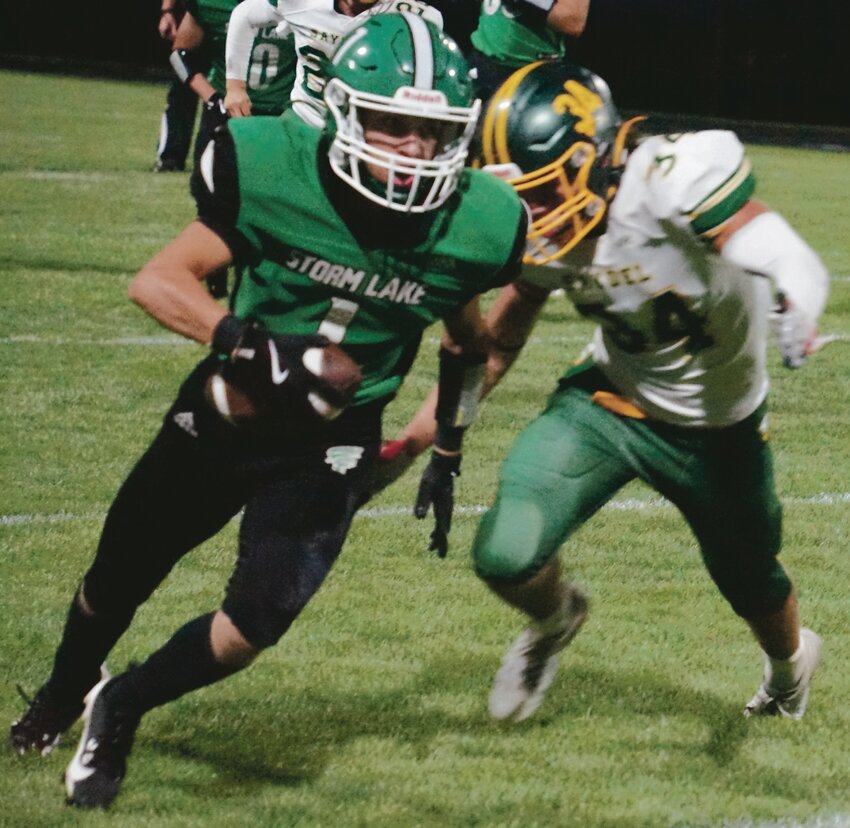 Storm Lake wide receiver Rylan Richardson tries to run past Saydel’s Grady Godwin after catching a pass in last Friday’s game. TIMES PILOT photo by JAMIE KNAPP