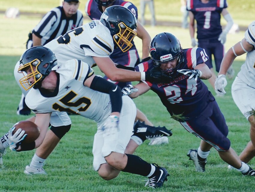 Alta-Aurelia’s Kadin Greene (24) attempts to tackle Kingsley-Pierson running back Tyler Koch during their game last Friday in Aurelia. Alta-Aurelia plays HMS tonight in Hartley. TIMES PILOT photo by JAMIE KNAPP