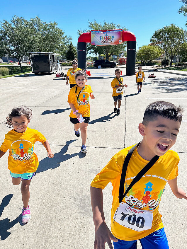 Wearing number 700 is Marcelino Medina, 6, who finished third in his age category.