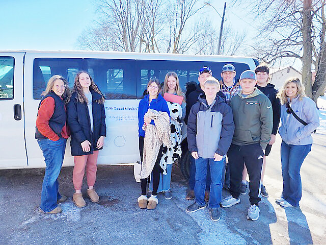 The group is ready to take off from church. From left: Lori Lyons, Alyssa Biede, Taylor Hansen, RaeLynn Hansen, Cole Ronfeldt, Lane Johnson, Cody Wunschel (plaid jacket), Jack Braunschweig, Matthew Hansen and Mallory McDonough.