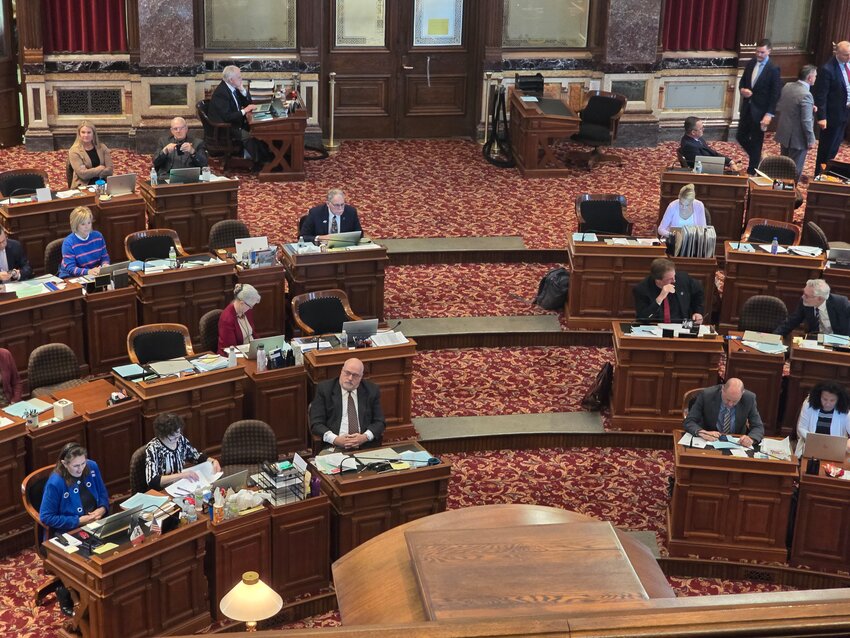 A view of Senator Lynn Evans (R-Aurelia) and Senator Kevin Alons (R-Salix) on the Senate floor after SF 57 passed unanimously.