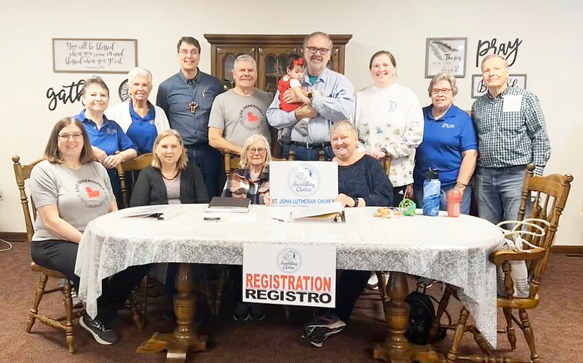 Swaddling Clothes volunteers at St. John Lutheran Church include, front row from left: Laurie Gaffney, Deb Matasovsky, Linda Zabloudil and Dianne Johnson. Back: Jan Magnussen, Denise Betts, Pastor Bruce Lesemann, Jim Zabloudil, Jerry Johnson, Melodie Khamphasouk, Emily Khamphasouk, Linda Faulk and Harlan Matasovsky. 