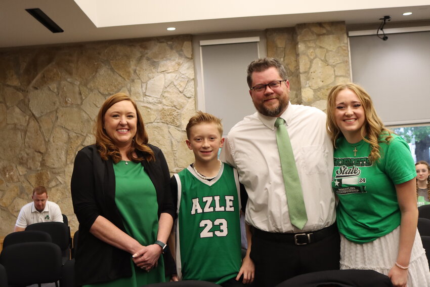Amy Yelle, Luke Yelle, Dave Yelle, and Elly Yelle at the Azle ISD administration building.