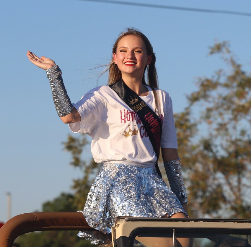 Springtown High School Class of 2024 valedictorian Kate Mitchell waves to the crowd during last year’s homecoming parade. Later at the homecoming football game, she was crowned queen. This school year, she also served as captain of the Springtown Showstoppers, drum major for the Sound of Springtown and prom queen.