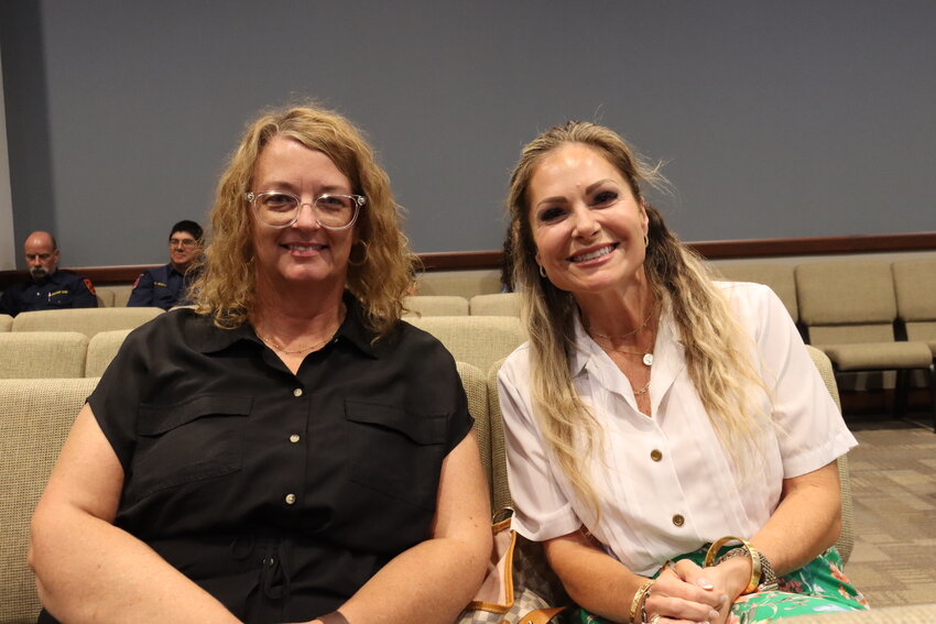 Shadi Sutton, left, and Tiffany Nelson, right, sit in the audience of an Azle City Council meeting shortly after their appointment to the city’s beautification committee.