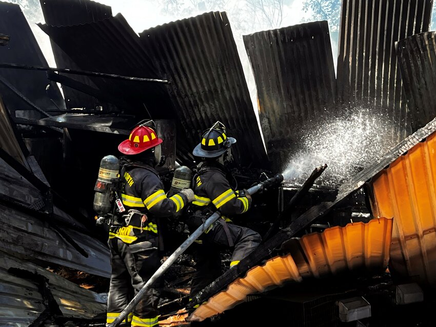 Firefighters extinguish a structure fire in Reno Sept. 17.