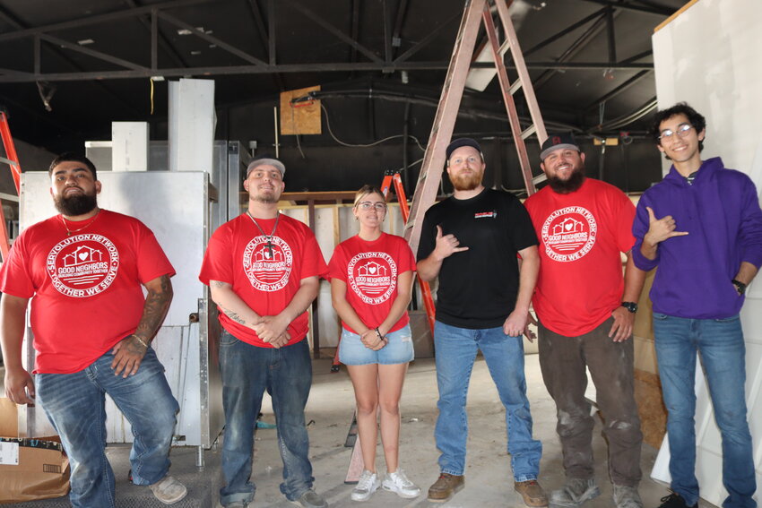 Good Neighbors volunteers stand with Johnathan Villegas in the soon-to-be new Adult & Teen Challenge kitchen.