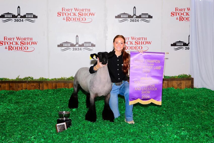AHS sophomore Landrie Lain with her Grand Champion Market Lamb, Panda.