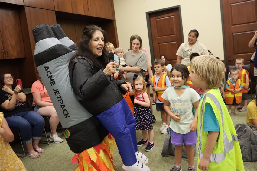 Carelock, dressed as a rocketeer, paraded and danced around the room with children in high visibility vests, superhero capes and astronaut costumes.