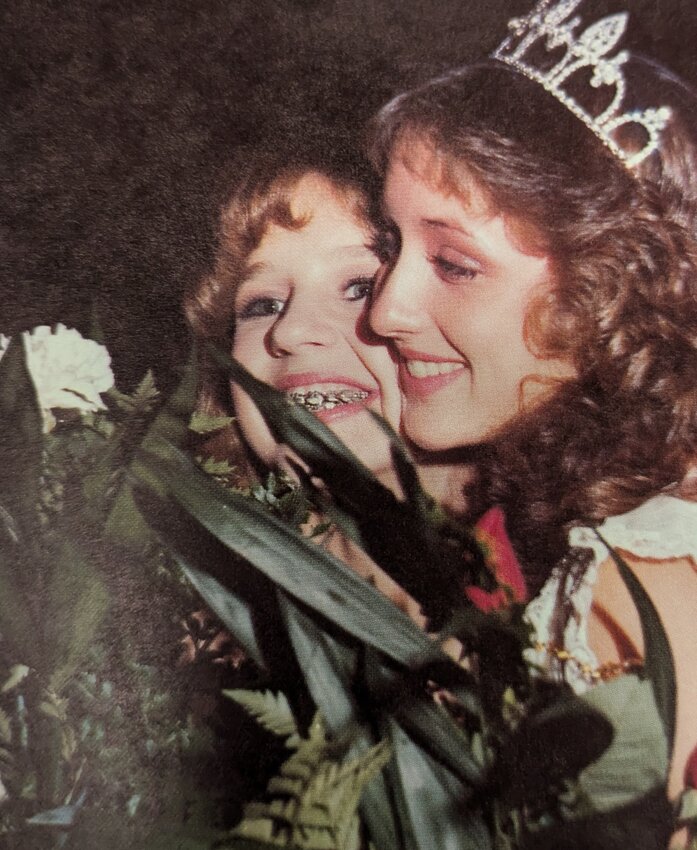 Pam Madlock poses with her friend at the 1981 homecoming dance.