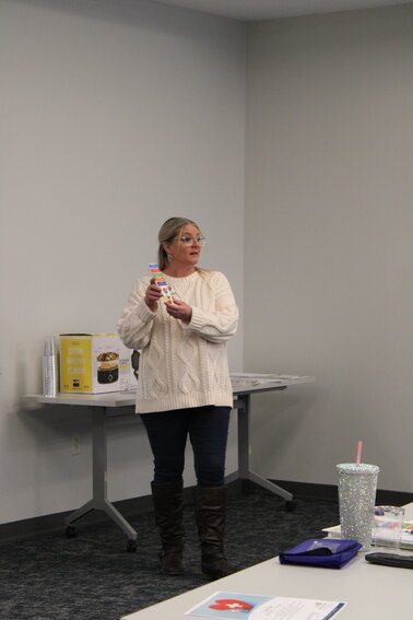 Legacy Oaks of Azle Community Relations Director Kelly Case talks to the seniors about the importance of maintaining healthy eating habits.