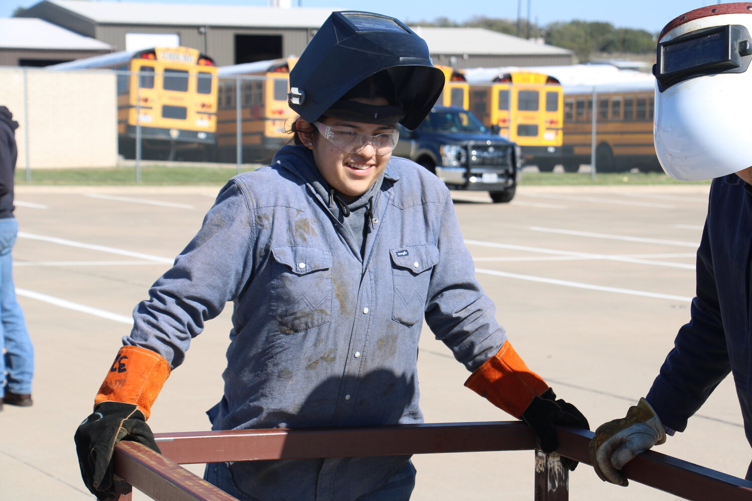 Chico High School junior Alexa Sanchez works with her teammates to build a table during SHS’ welding contest on Nov. 3 at Porcupine Stadium.